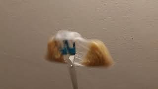 Bag of macaroni attached to spinning scissors