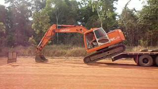 unloading excavator with no ramps