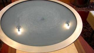 Fluid-filled coffee table in motion