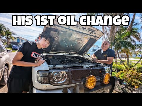 Teaching my son's 1st oil change on our Mitsubishi Montero. Teaching my son's 1st oil change on our Mitsubishi Montero.