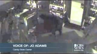 Black bear carefully breaks into candy store