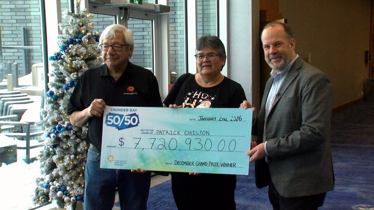 Winner collects largest-ever Thunder Bay 50/50 cheque - YouTube
