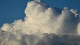 Dancing fluffy puffy clouds timelapse 4k