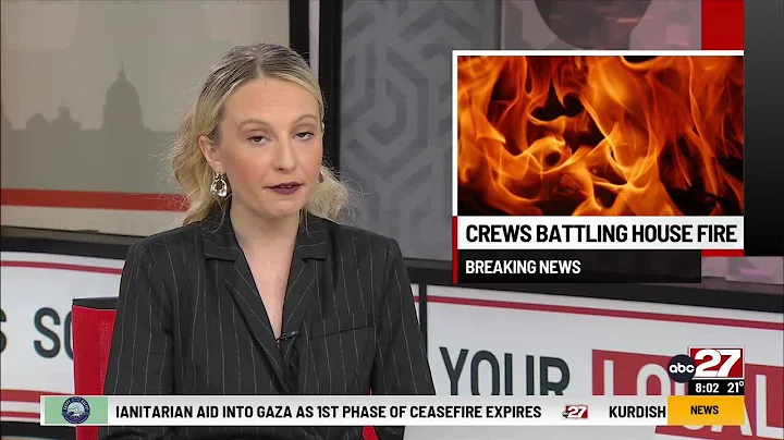 Crews battle house fire