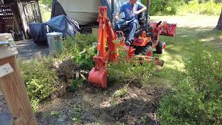 Digging with Back hoe Kubota BX23S P1