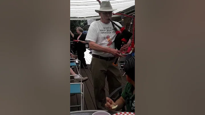 Ray Curran the Legend, playing bagpipes at a local...