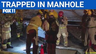 Firefighters rescue woman from manhole | FOX 11 LA