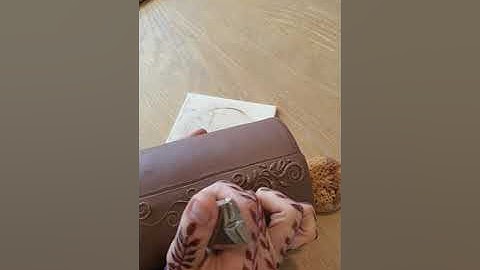 Full video: henna cone slip trailing on a plant pot. Vine design on pottery.