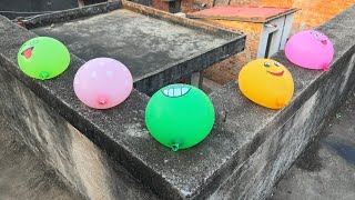 Handle rainbow water balloons at high altitude 🎈
