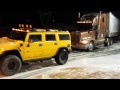 Hummer H2 pulling a semi truck