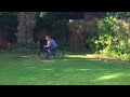 The boys on the bike in the garden