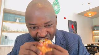 I try the Timehri Burger at the Courtyard Marriott Hotel at Cheddi Jagan International Airport 