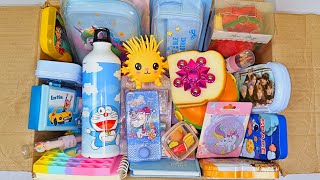 Box full of cute stationery - doraemon water bottle, unicorn notebook, space pencil case, sharpner