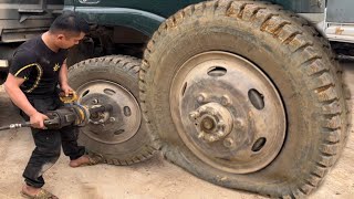 Repair damaged truck tires along the road