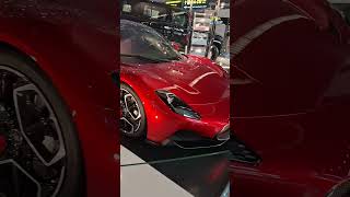 Gleaming Red Ferrari  reflects the neon lights. Luxury at Doha  Airport  ✨🏎️
