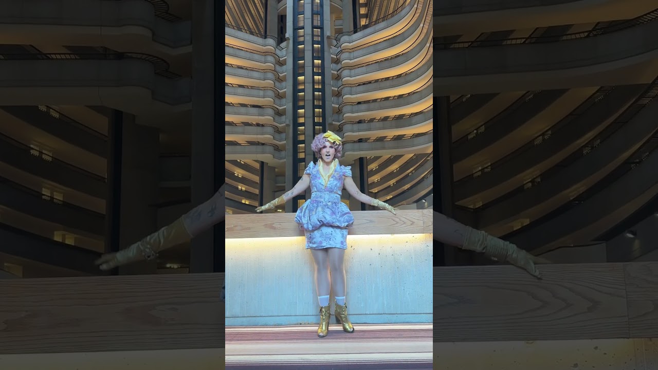 cosplaying effie trinket at the hotel where they filmed the capitol scenes for the hunger games!