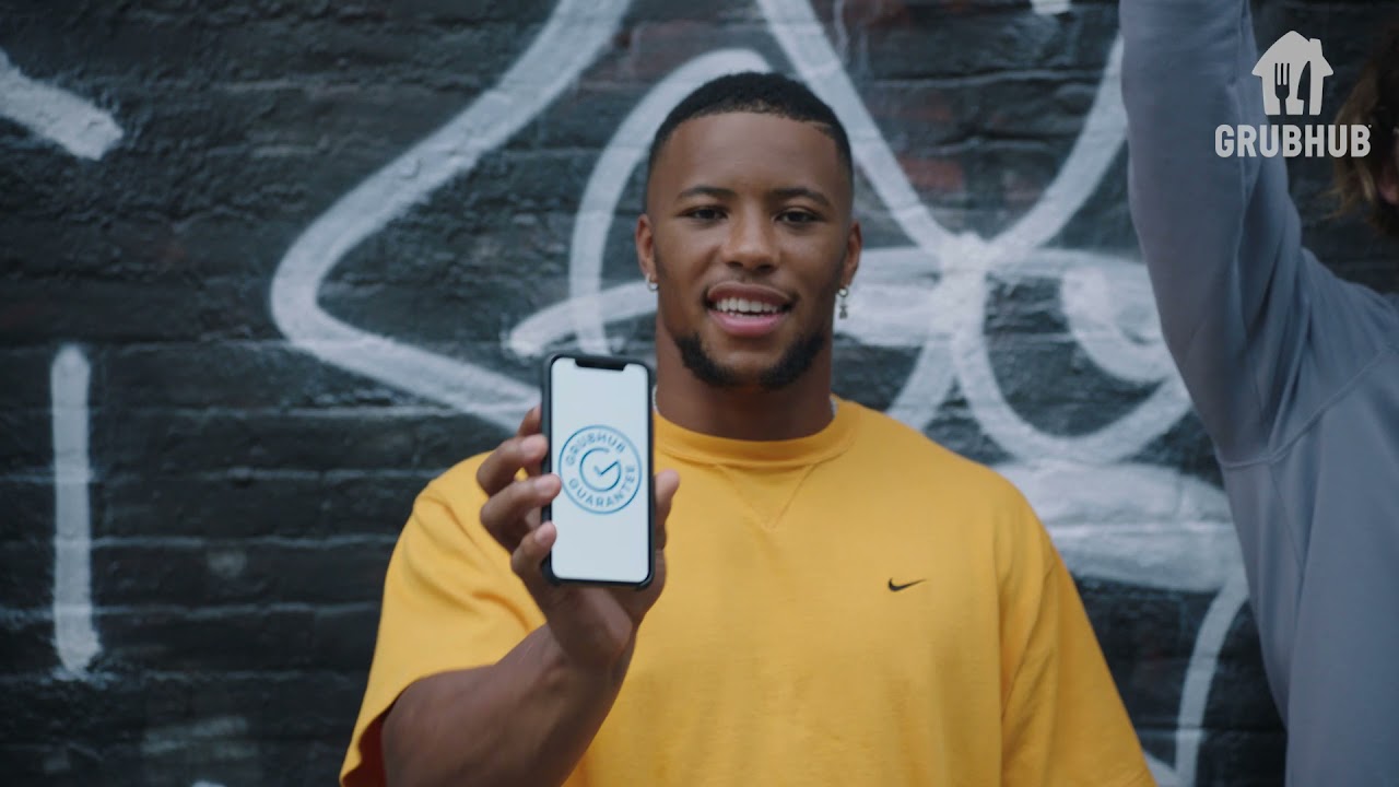 Grubhub Guarantee with Saquon Barkley and Dude with Sign - Grubhub Guarantee with Saquon Barkley and Dude with Sign
