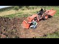 Kubota B2601 and Piranha toothbar digging a trash hole - Bittersweet house flip Part 5