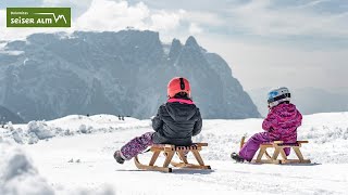 Tobogganing and sledding on the Seiser Alm in the Dolomites