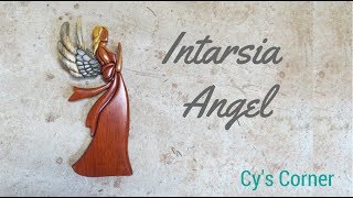 Intarsia Angel I found a stained glass pattern and used it to make an intarsia. I used Yellow heart, red heart, blue pine, and some mystery wood for