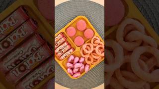 Filling Platter With Pink Sweets