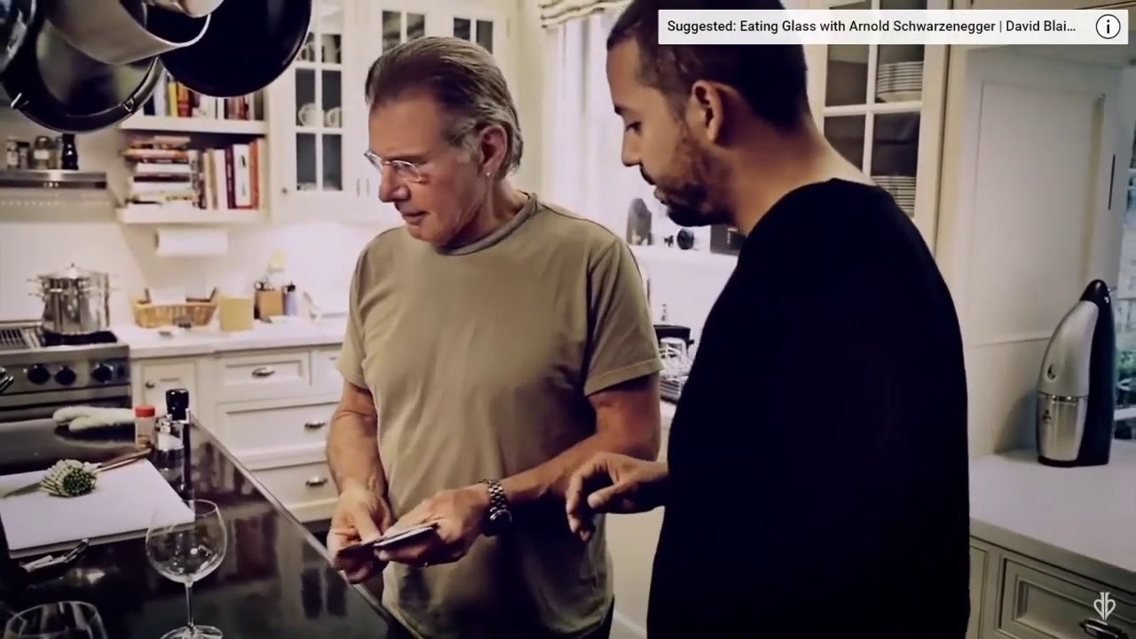 Harrison Ford is startled by David Blaine's card in orange