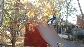 Old man skateboarding halfpipe back yard
