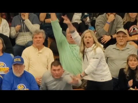 Over-Eager Mom Cheers on Her Son During Wrestling Match