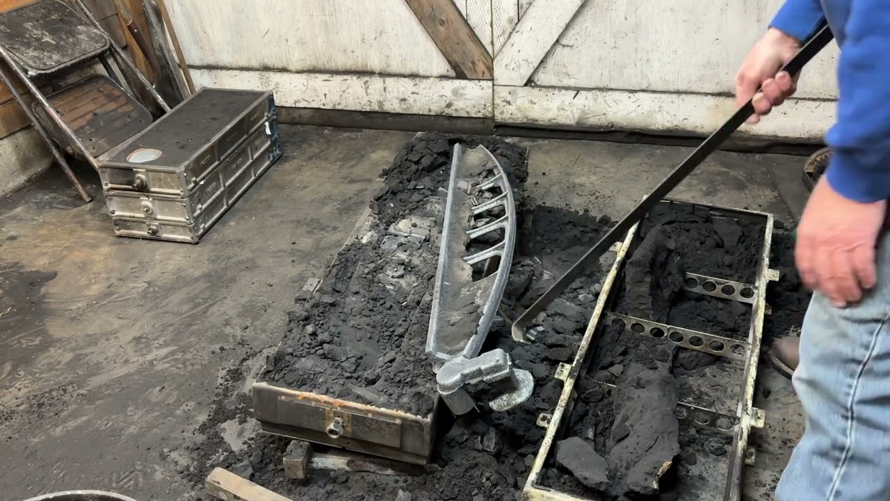 Shaking an iron casting out of the sand 
