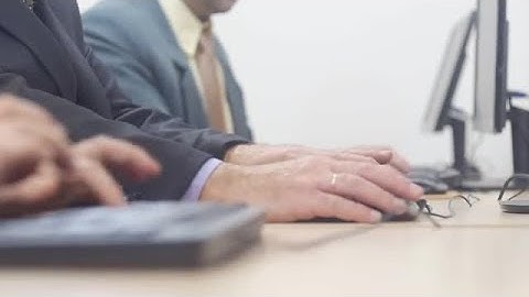 Men Working On Computers Stock Video