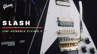 Slash shows Mark Agnesi one of his newest guitars