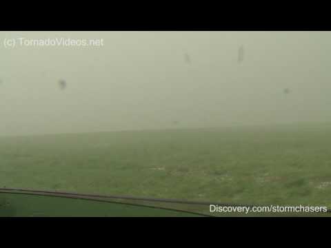 Video of the TornadoVideos.net Dominator getting stuck in a ditch while pounded by 80 mph wind-driven hail up to baseball size in the core of the Goshen County, Wyoming tornadic supercell on June 5, 2009. Check out all the action on Storm Chasers this fall on Discovery Channel.