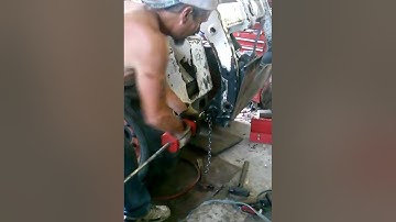 Removing the pivot pin bushings on a Bobcat