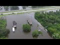 Hurricane Barry levees overtopping in Myrtle Grove, La outside with homes flooded drone