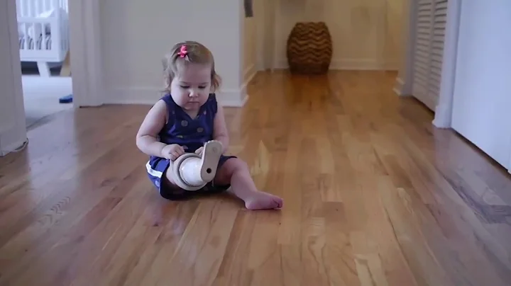 First Moments: 1 yr old Maely puts prosthetic leg on all by herself