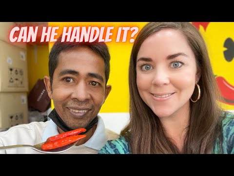 Her Thai husband tries the spiciest dish at Mark Wiens Bangkok restaurant