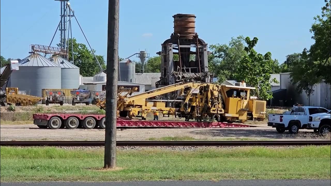 Loading Train Track Maintenance Cars from Low Boy Trailers In 103