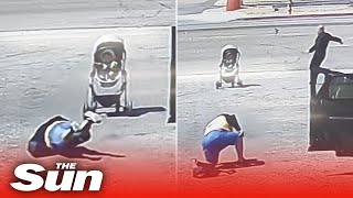 Hero saves baby in stroller from rolling into ROAD after woman falls trying to stop it