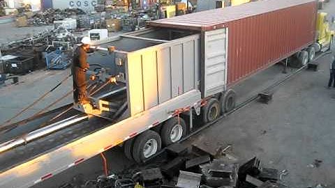loading metal scrap in containers with machine  video