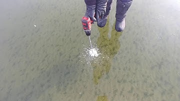 checking ice thickness on lake Wabamun