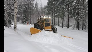 Volvo Tractor Snow Plowing village in Lappland.