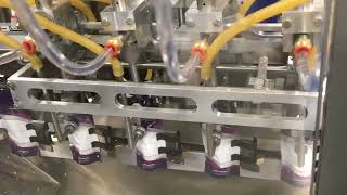 H2022619. IMTN. 5-21. Four Moving nozzles 85 ppm liquid fill. Duel Die cut bottle shape