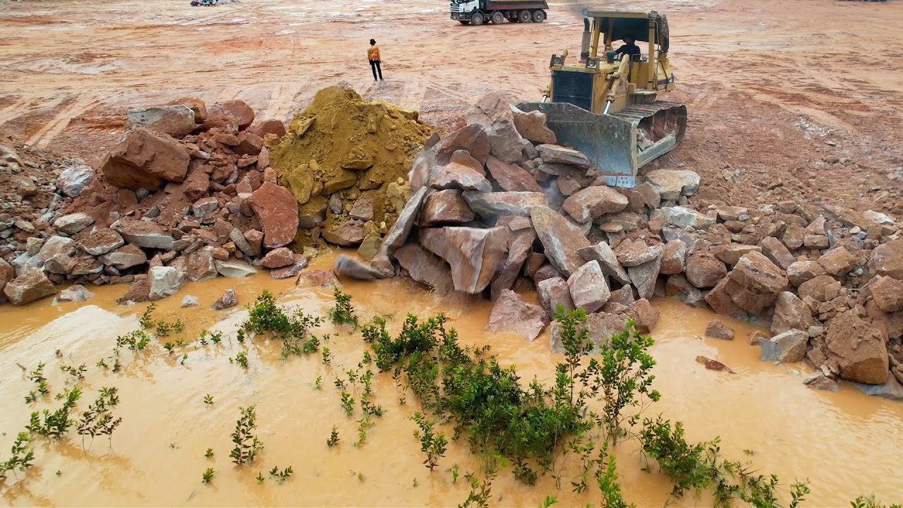 Amazing Huge Land Reclamation Process Strong Mighty Bulldozer Work Pushing Huge Stones Landfilling