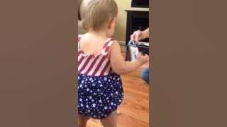 Coaxing baby to walk