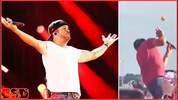 Luke Bryan gets hit in the face by object thrown on stage during concert