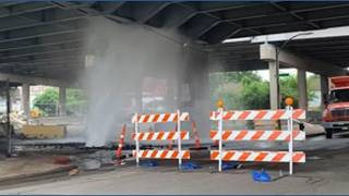 Hydrant hit, causing main break under downtown overpass