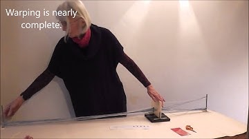 Threading the double slotted Sunna heddle