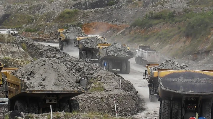 Komatsu HD785, CAT 777D & 777E Dump Trucks Working On A Busy Coal Mines