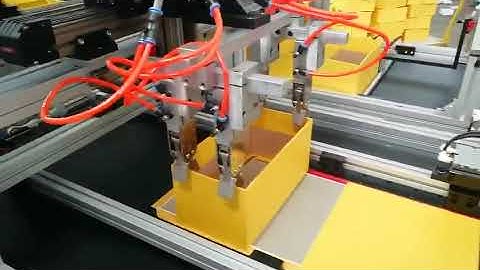 Book style box assembling and folding machine