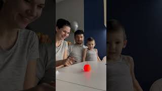 Lady Demonstrates Sparkler Experiment to Husband and Son